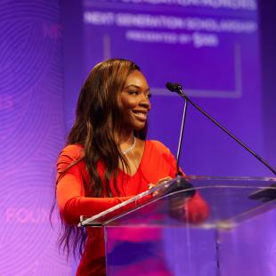 2022 NRF Foundation Honors Amaiya Sims onstage introducing 2021 finalists