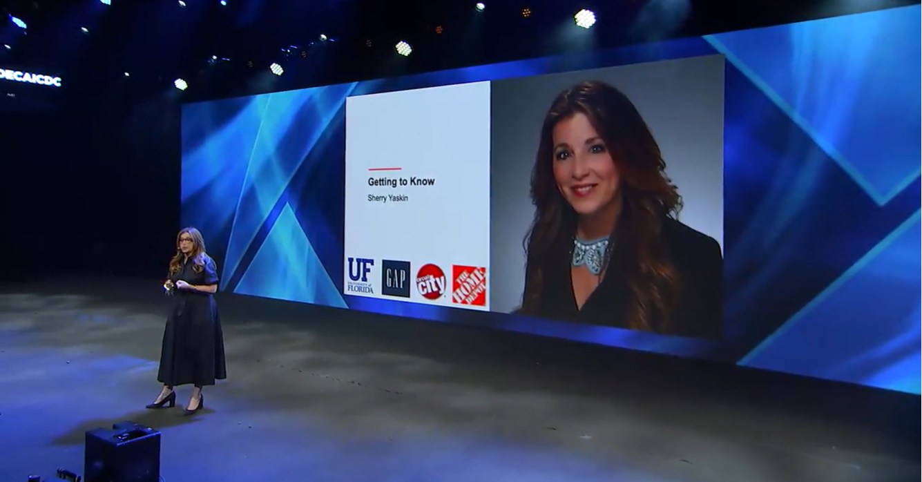 Sherry Yaskin presenting onstage at DECA conference 