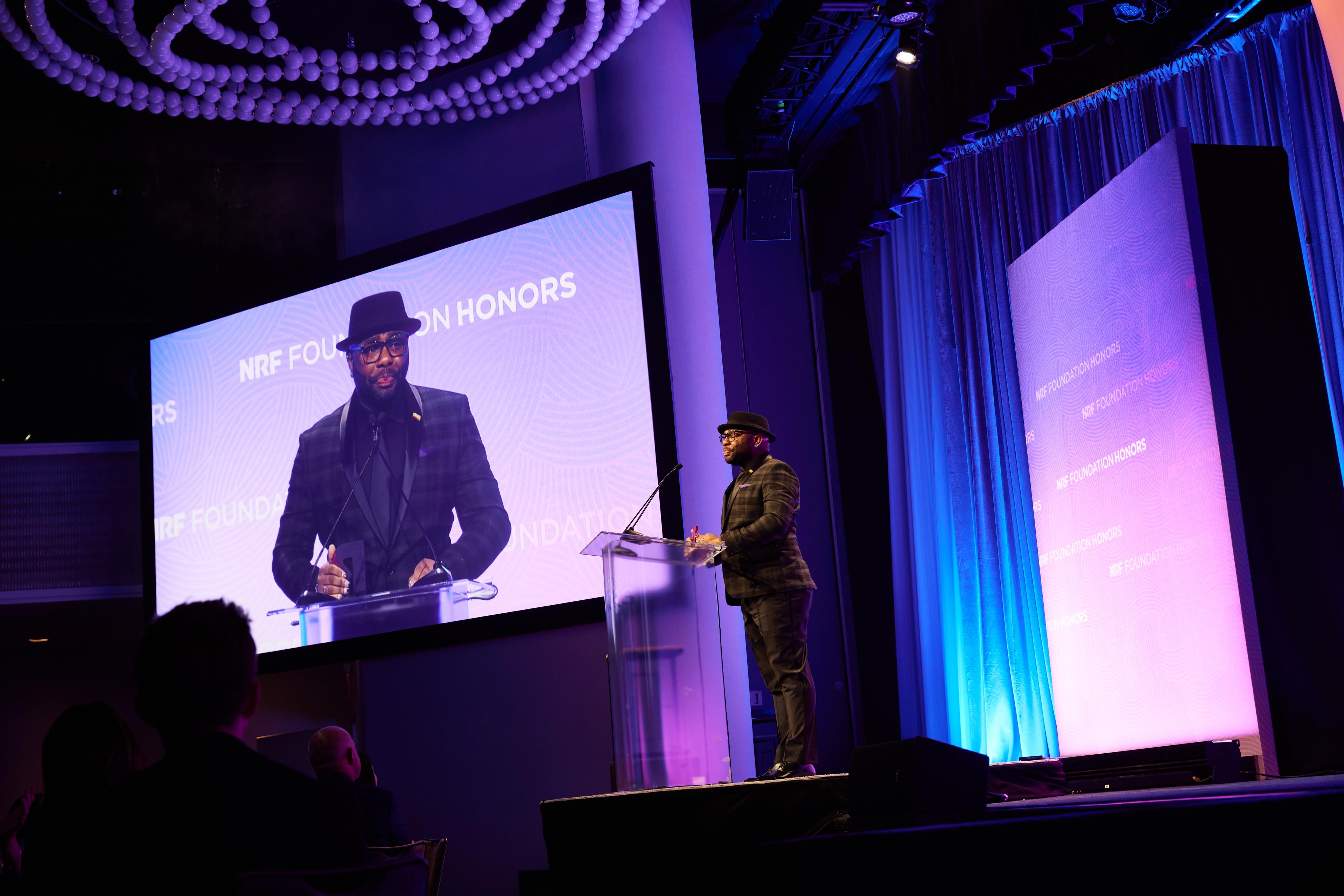 Robert Davison Long onstage at podium