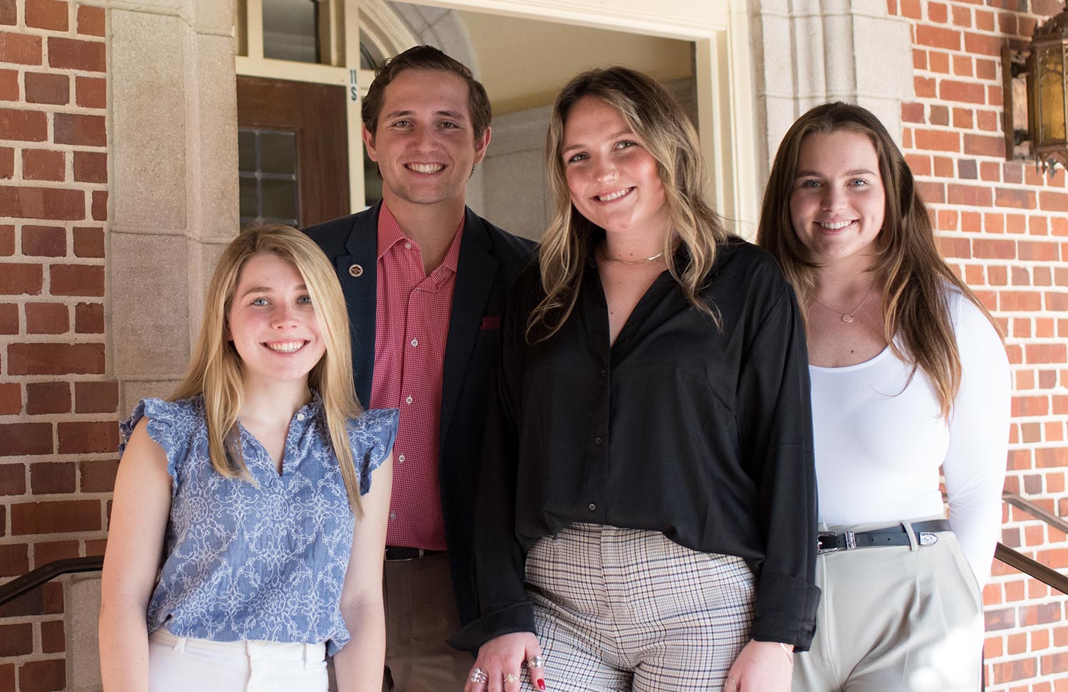 Delaney Hanson, Grace Long, Alison MacCloud, & Gustavo Rubio pose for a photo together.