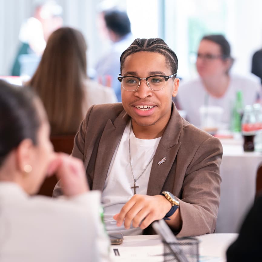 Kev Addison discusses an important topic with fellow Emerging Leaders Summit attendees.