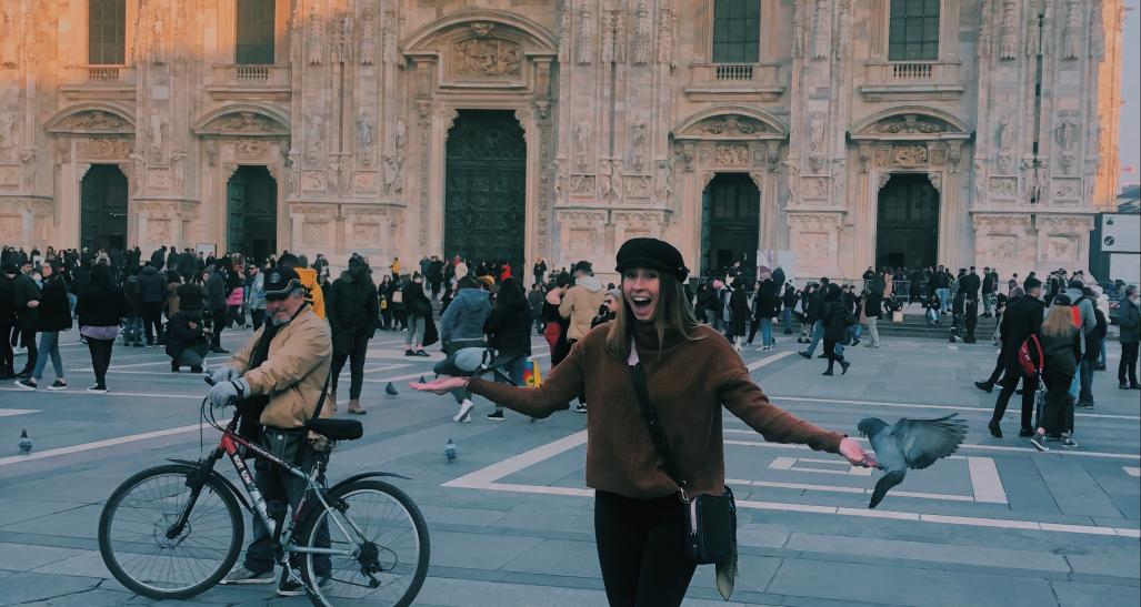 Student posing in front of building in Milan