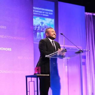 John-Martin Rigsby at the podium onstage at the 2022 NRF Foundation Honors